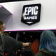 Attendees walk by the Epic Games booth at the 2019 GDC Game Developers Conference on March 20, 2019 in San Francisco, California.